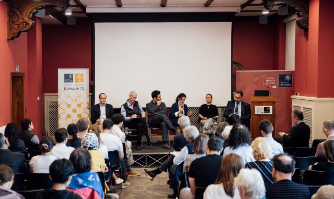 Image of speakers at Daron Acemoglu event